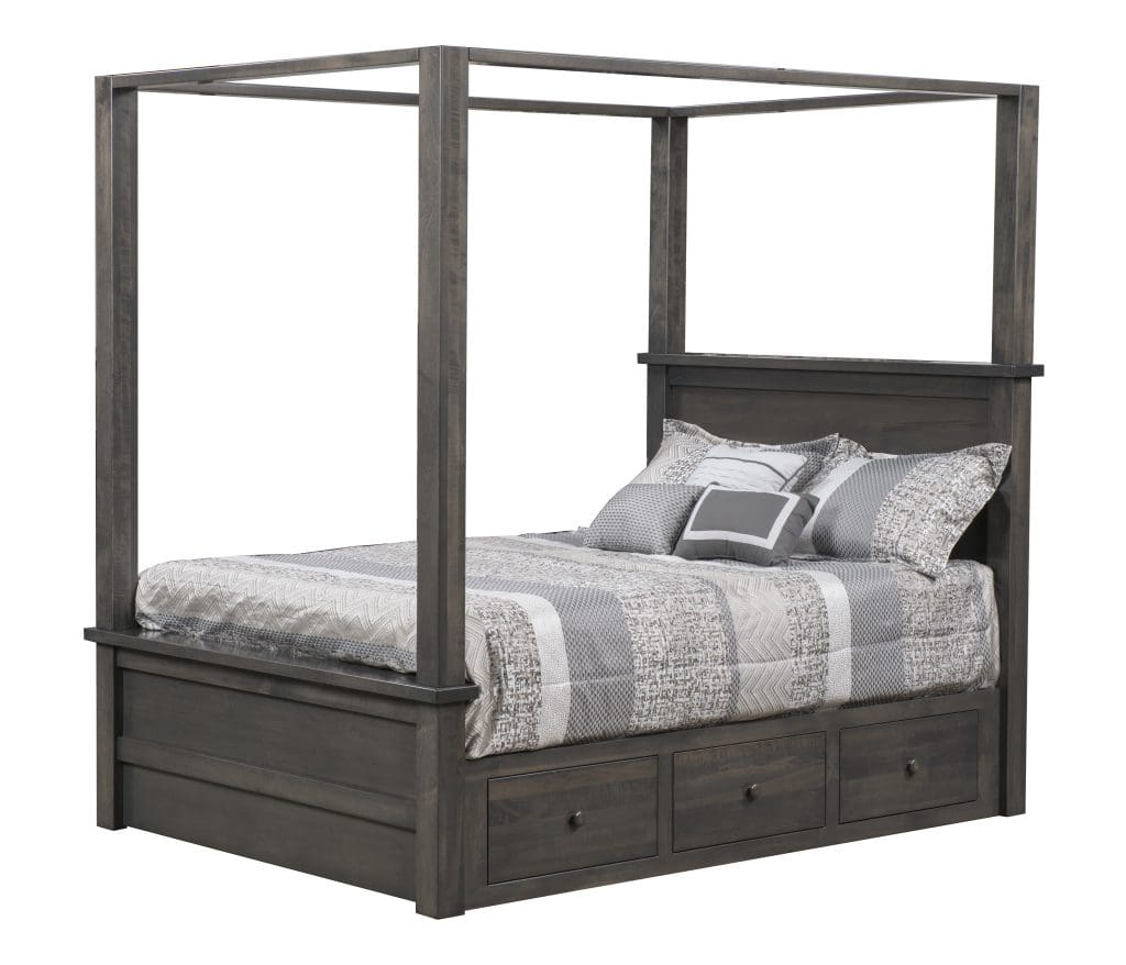 Dark gray hardwood canopy bed with light gray and white bedding and built-in drawers in the bed frame under the mattress.