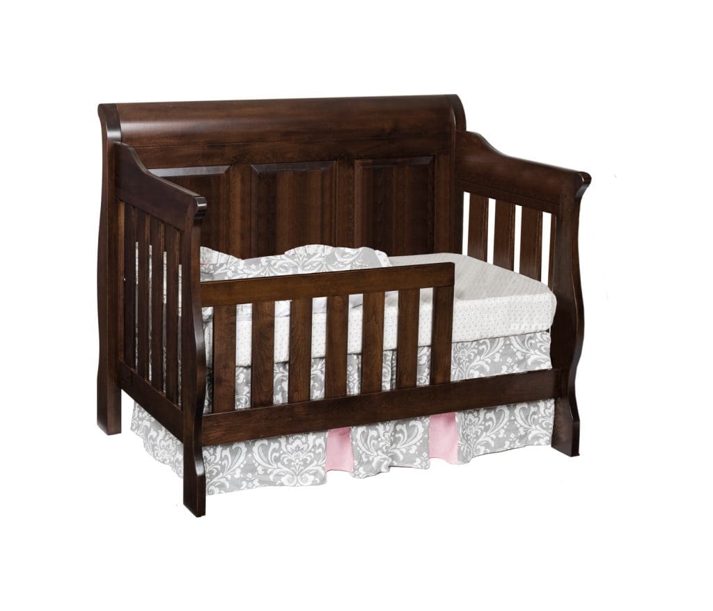 Traditional panel toddler bed with dark brown stained hardwood sides and base.