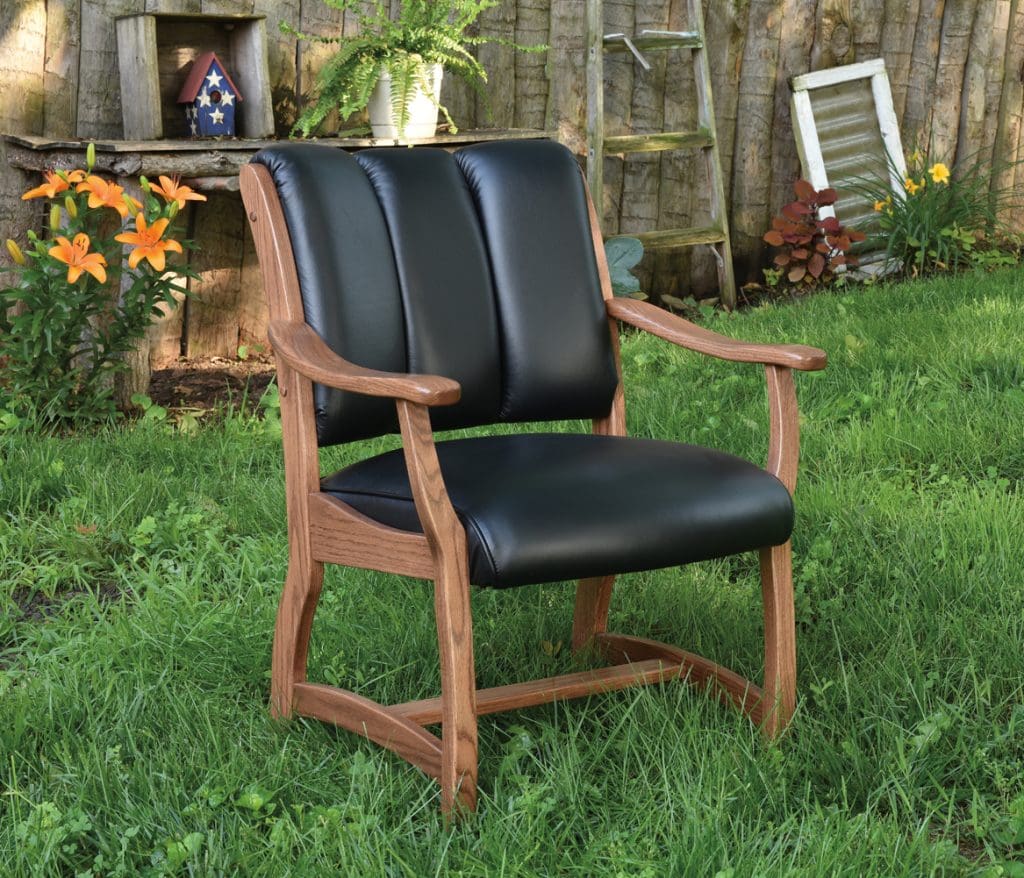 Midland accent chair with a stained hardwood frame and black leather upholstery.