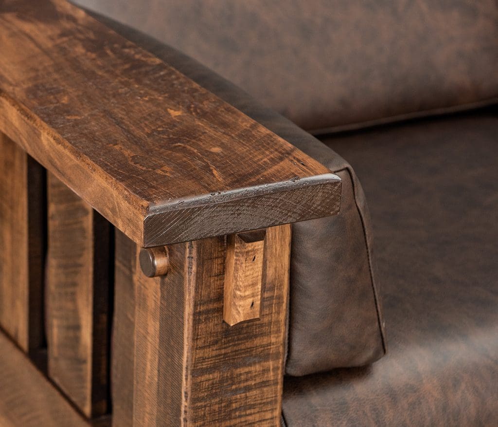 Close up of the armrest on a Houston Loveseat with leather upholstery and hardwood arms.