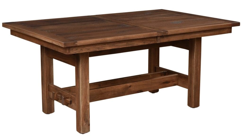 Brown stained wood Sutter Mills Trestle dining table with a rectangle top and a trestle base.