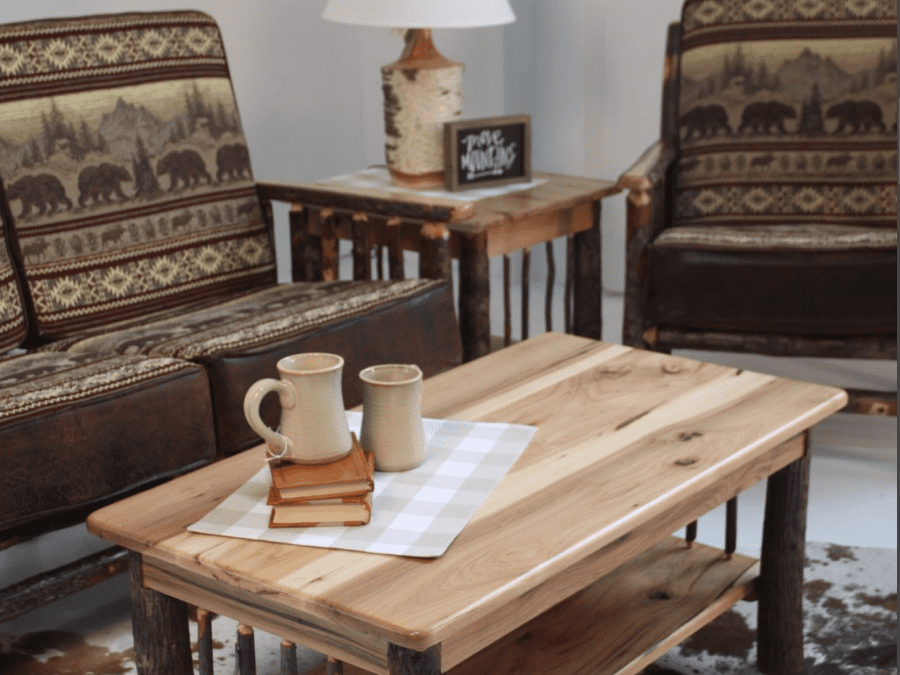 hickory lodge living room with couch, chair, and coffee table with bear fabric